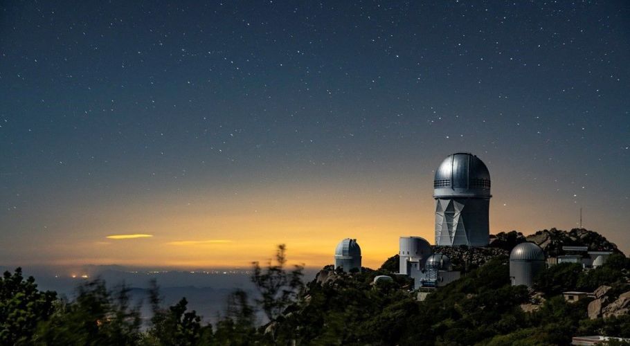 The Dark Energy Spectroscopic Instrument sits atop the Mayall 4-Meter Telescope at Kitt Peak National Observatory.